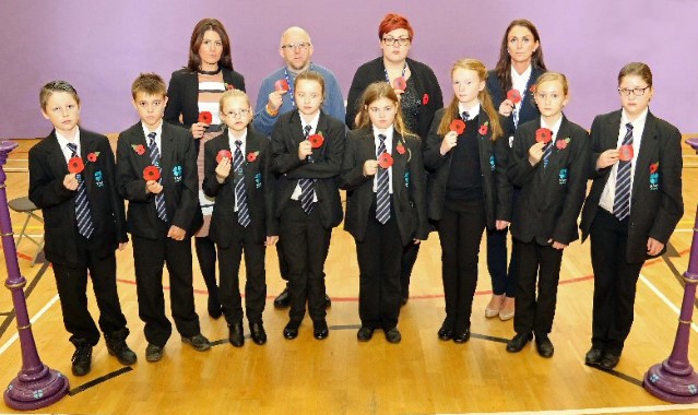 600 poppies are handed to students in special act of worship 