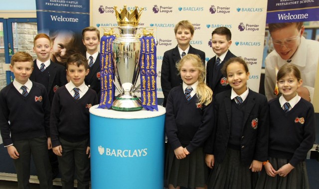 Prep pupils lift the Premier League trophy