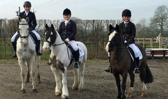 Equestrian team members ride to victory