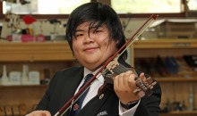 Student adds a new string to his bow