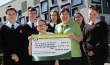 Committed fundraiser hands over cheque 