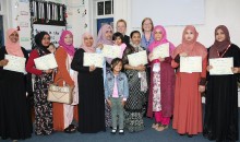 Parents receive certificates for language skills