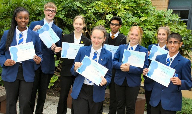 Pupils are rewarded with certificates at school assembly 