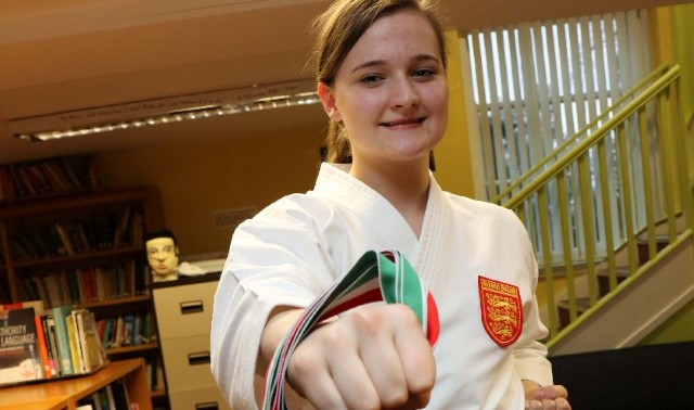Karate expert gets her kicks with two championship gold medals