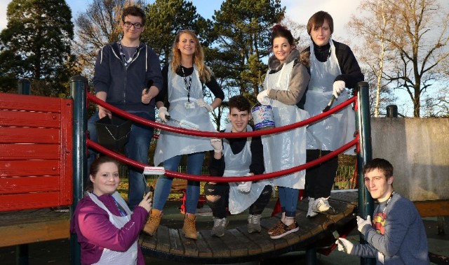 Students spruce up play equipment at South Park