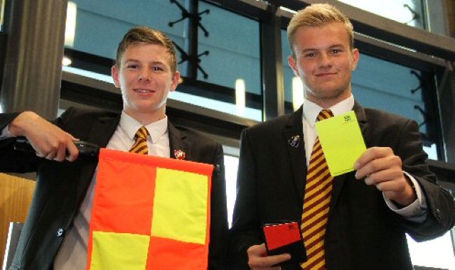 Young football officials have a ball in the USA Young football officials have a ball in the USA