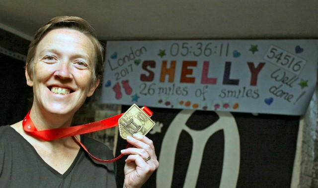 Runner completes marathon run for charity