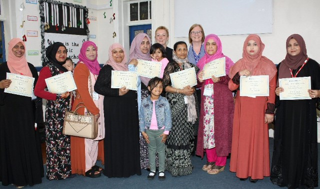 Parents receive certificates for language skills