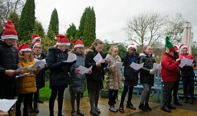 Christmas carollers spread festive cheer 