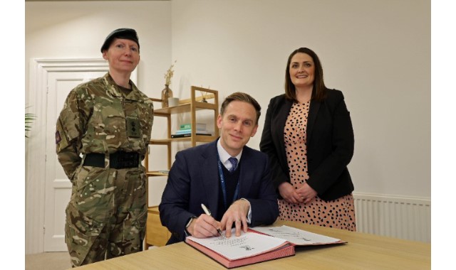 Head signs pledge to help military community