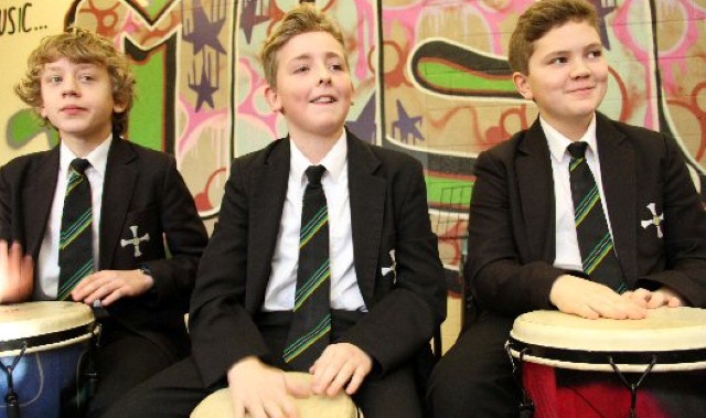 Musical students perform to the beat of a drum