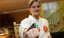 Karate expert gets her kicks with two championship gold medals