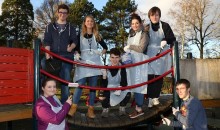 Students spruce up play equipment at South Park