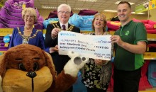 Hospice receives cheque for doggie day out