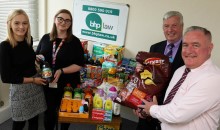 Law firm donates to church foodbank