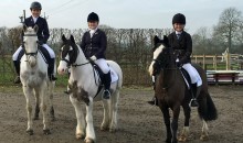 Equestrian team members ride to victory