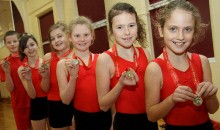 Tiny tumblers take gold in regional gymnastics competition