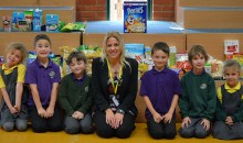 Schoolchildren present food bank with harvest collection