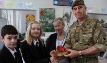 Army Colonel is presented with poppy tribute to remember